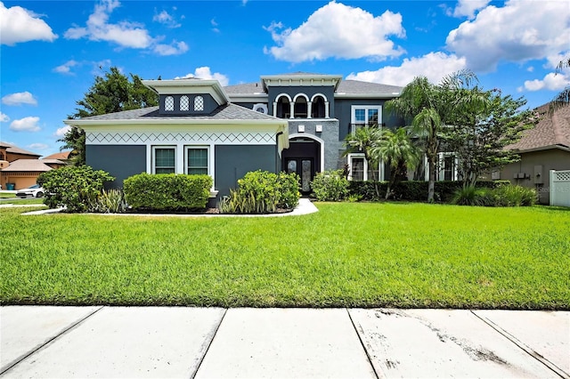 3241 Evening Breeze Loop, Wesley Chapel, FL 33544 - view of front facade featuring a front yard and stucco siding