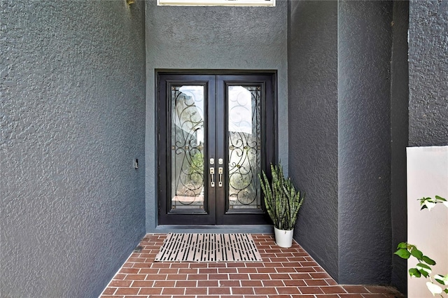 3241 Evening Breeze Loop, Wesley Chapel, FL 33544 - doorway to property with french doors and stucco siding