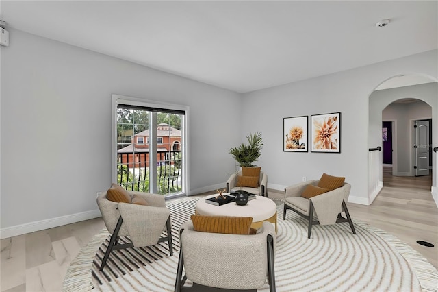 3241 Evening Breeze Loop, Wesley Chapel, FL 33544 - living area with arched walkways and light wood finished floors