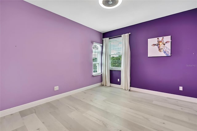 3241 Evening Breeze Loop, Wesley Chapel, FL 33544 - empty room featuring baseboards and light wood finished floors