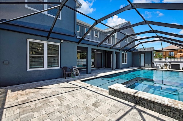 3241 Evening Breeze Loop, Wesley Chapel, FL 33544 - view of pool featuring a patio, glass enclosure, and a pool with connected hot tub