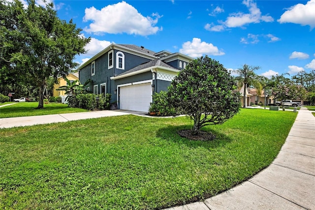 3241 Evening Breeze Loop, Wesley Chapel, FL 33544 - view of front of property with stucco siding, driveway, a front yard, a garage, and roof with shingles