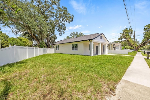 8319 N Ogontz Ave, Tampa, FL 33604 - view of front facade with stucco siding and a fenced backyard