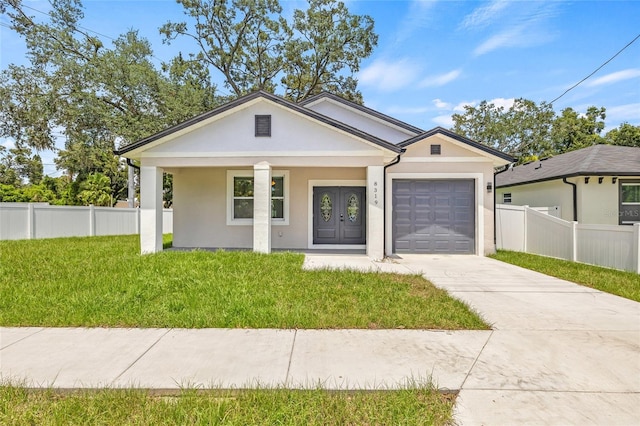 8319 N Ogontz Ave, Tampa, FL 33604 - view of front of property with a garage, concrete driveway, stucco siding, and a porch