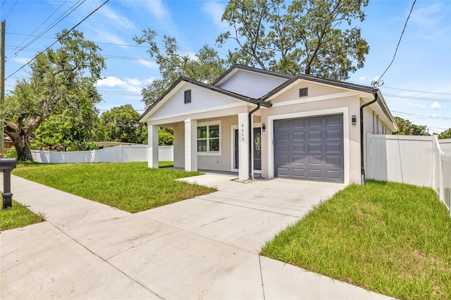 8319 N Ogontz Ave, Tampa, FL 33604 - view of front of house with driveway, stucco siding, a garage, and a porch