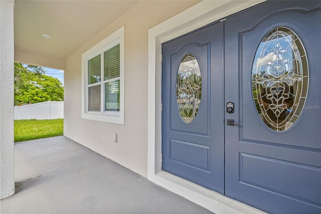 8319 N Ogontz Ave, Tampa, FL 33604 - view of exterior entry featuring board and batten siding and covered porch