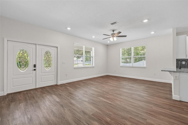 8319 N Ogontz Ave, Tampa, FL 33604 - foyer featuring dark wood-style floors, ceiling fan, and recessed lighting