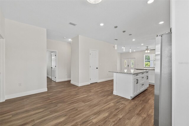 8319 N Ogontz Ave, Tampa, FL 33604 - kitchen with freestanding refrigerator, open floor plan, white cabinetry, recessed lighting, and dark wood-style flooring