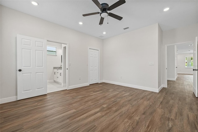 8319 N Ogontz Ave, Tampa, FL 33604 - unfurnished bedroom with wood finished floors, recessed lighting, ensuite bath, and a ceiling fan