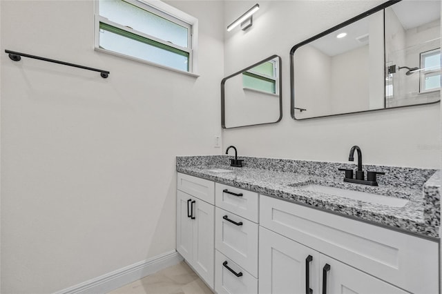 8319 N Ogontz Ave, Tampa, FL 33604 - full bathroom featuring plenty of natural light, double vanity, marble look tiles, and a shower