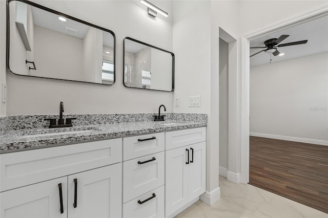 8319 N Ogontz Ave, Tampa, FL 33604 - bathroom featuring ceiling fan, double vanity, and marble finish flooring