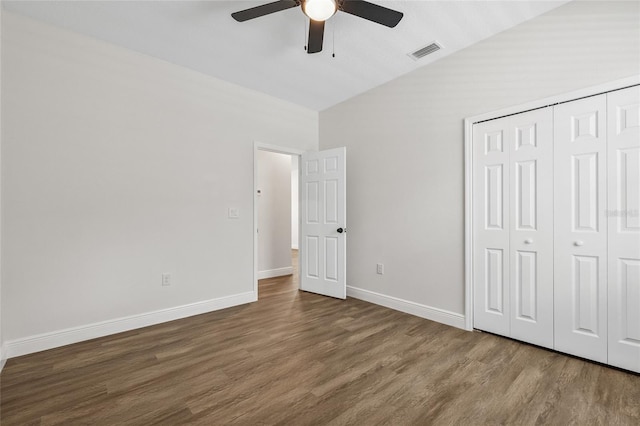 8319 N Ogontz Ave, Tampa, FL 33604 - unfurnished bedroom featuring lofted ceiling, wood finished floors, a closet, and a ceiling fan