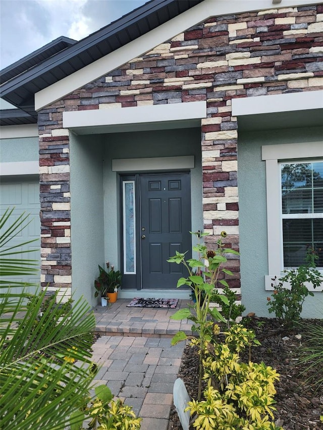 12351 Nouveau Ave, Spring Hill, FL 34610 - doorway to property with stucco siding