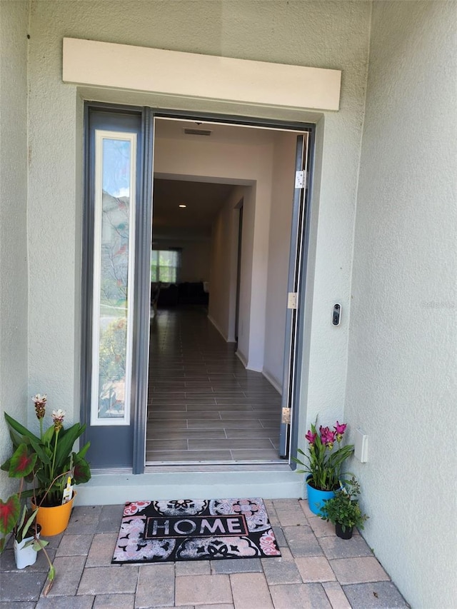 12351 Nouveau Ave, Spring Hill, FL 34610 - property entrance with stucco siding