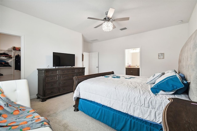 12351 Nouveau Ave, Spring Hill, FL 34610 - bedroom with carpet floors, a closet, a spacious closet, ceiling fan, and ensuite bathroom
