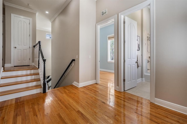 650 Geneva Pl, Tampa, FL 33606 - foyer entrance featuring crown molding, healthy amount of natural light, light wood-style flooring, and recessed lighting