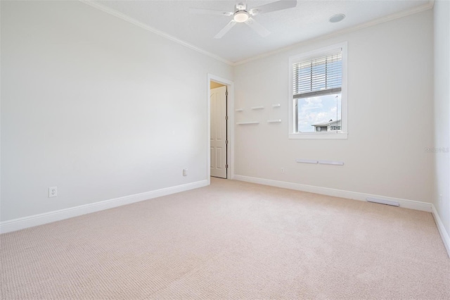 650 Geneva Pl, Tampa, FL 33606 - unfurnished room featuring crown molding, light colored carpet, and a ceiling fan