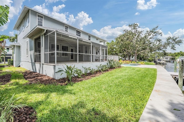 650 Geneva Pl, Tampa, FL 33606 - back of house with a sunroom and a lawn