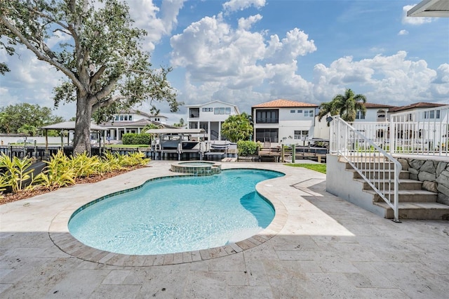 650 Geneva Pl, Tampa, FL 33606 - view of pool featuring stairway, a residential view, a pool with connected hot tub, and a patio area