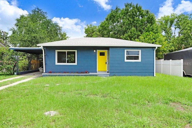 201 83rd Ave N, Saint Petersburg, FL 33702 - view of front of property with a carport and roof with shingles