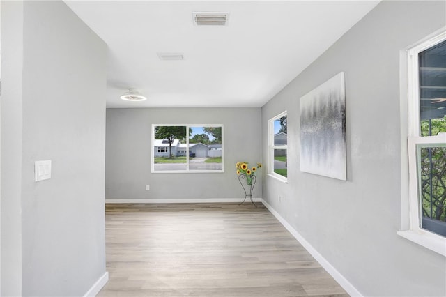 201 83rd Ave N, Saint Petersburg, FL 33702 - spare room featuring wood finished floors and baseboards