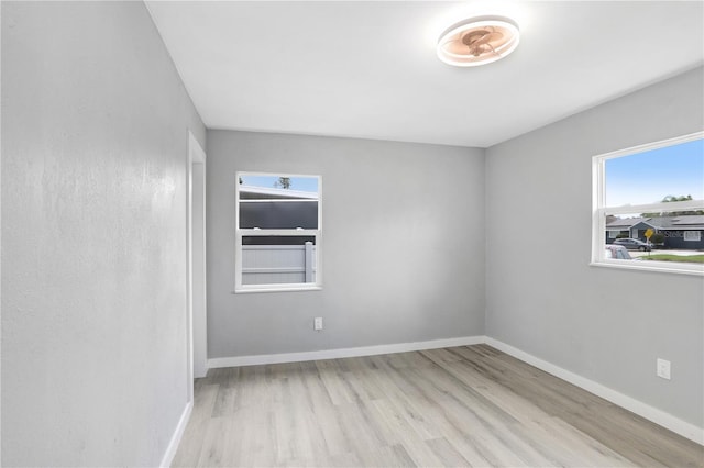 201 83rd Ave N, Saint Petersburg, FL 33702 - empty room with wood finished floors and baseboards