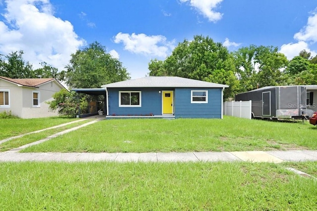 201 83rd Ave N, Saint Petersburg, FL 33702 - view of front facade with an attached carport and a front lawn