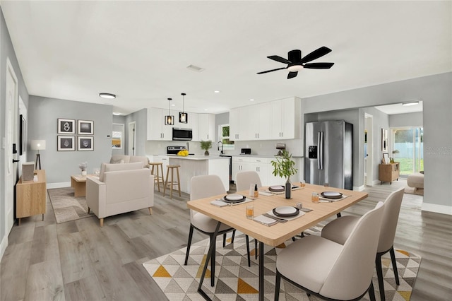 1223 Jasmine Way, Clearwater, FL 33756 - dining space featuring light wood finished floors and a ceiling fan