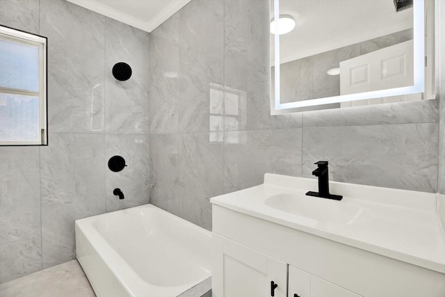 1223 Jasmine Way, Clearwater, FL 33756 - bathroom featuring tile walls, vanity, bathtub / shower combination, and ornamental molding