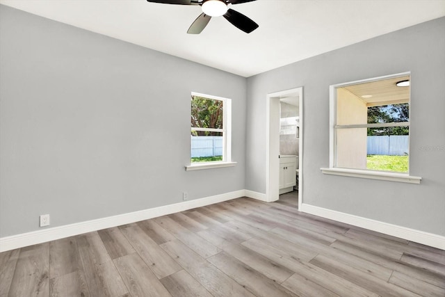 1223 Jasmine Way, Clearwater, FL 33756 - spare room featuring a ceiling fan and wood finished floors