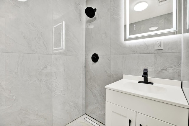 1223 Jasmine Way, Clearwater, FL 33756 - full bath featuring a shower, vanity, and tile walls