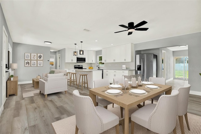 1223 Jasmine Way, Clearwater, FL 33756 - dining room featuring light wood-style flooring and ceiling fan