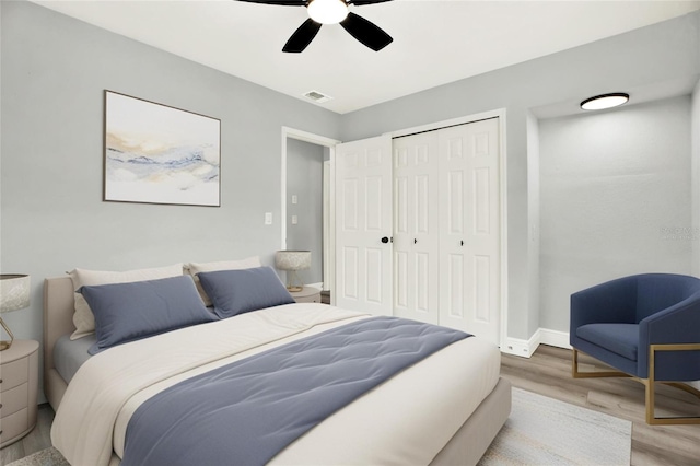 1223 Jasmine Way, Clearwater, FL 33756 - bedroom with light wood-style flooring, a closet, and ceiling fan