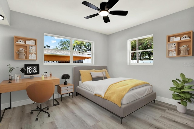 1223 Jasmine Way, Clearwater, FL 33756 - bedroom featuring wood finished floors, an office area, and ceiling fan