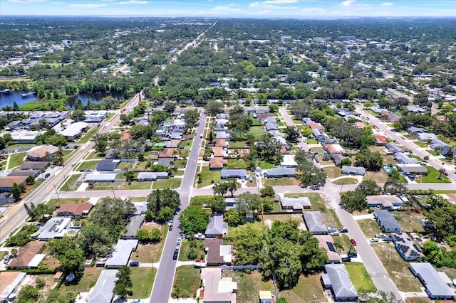 1223 Jasmine Way, Clearwater, FL 33756 - aerial view of property and surrounding area with nearby suburban area and a nearby body of water