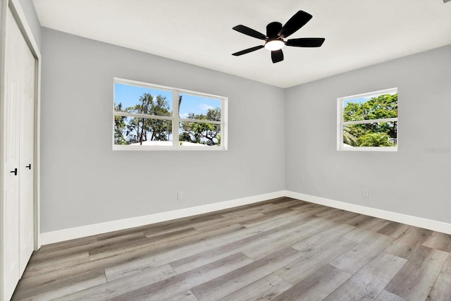 1223 Jasmine Way, Clearwater, FL 33756 - spare room featuring wood finished floors and ceiling fan