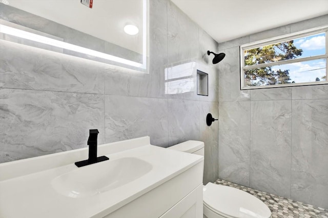 1223 Jasmine Way, Clearwater, FL 33756 - bathroom with tiled shower, vanity, and tile walls