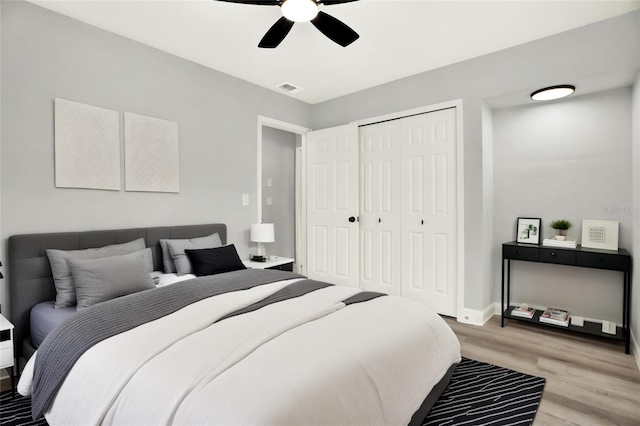 1223 Jasmine Way, Clearwater, FL 33756 - bedroom featuring light wood finished floors, a closet, and a ceiling fan