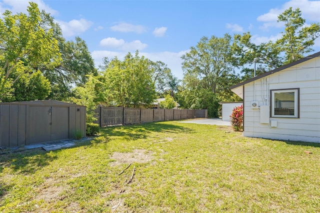 1601 Paloma Ln, Dunedin, FL 34698 - view of yard featuring a storage shed and a patio