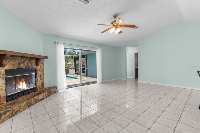 5112 Odin St, Spring Hill, FL 34608 - unfurnished living room featuring a ceiling fan, tile patterned floors, lofted ceiling, a fireplace, and a textured ceiling