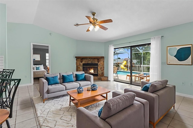 5112 Odin St, Spring Hill, FL 34608 - living room featuring a ceiling fan, light tile patterned floors, lofted ceiling, and a fireplace