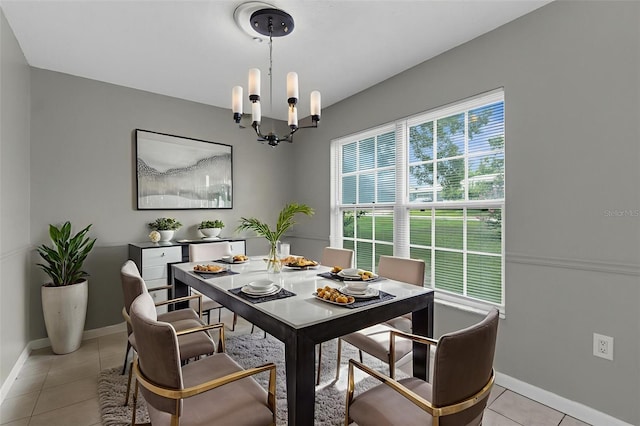 5112 Odin St, Spring Hill, FL 34608 - dining space with light tile patterned flooring and a chandelier