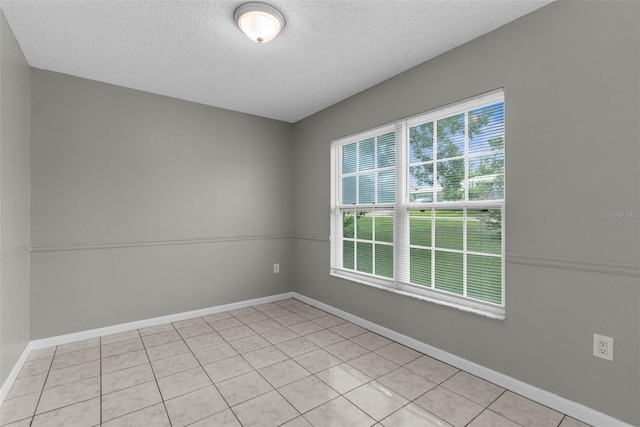 5112 Odin St, Spring Hill, FL 34608 - empty room with a textured ceiling and light tile patterned floors