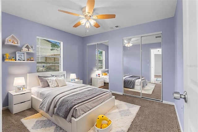 5112 Odin St, Spring Hill, FL 34608 - carpeted bedroom featuring two closets and a ceiling fan