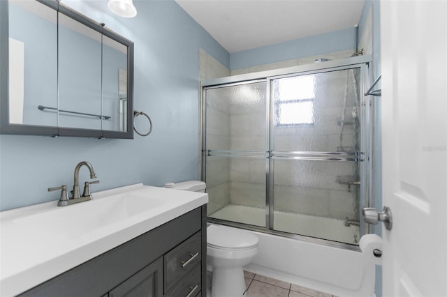 5112 Odin St, Spring Hill, FL 34608 - full bathroom featuring vanity, shower / bath combination with glass door, and tile patterned floors