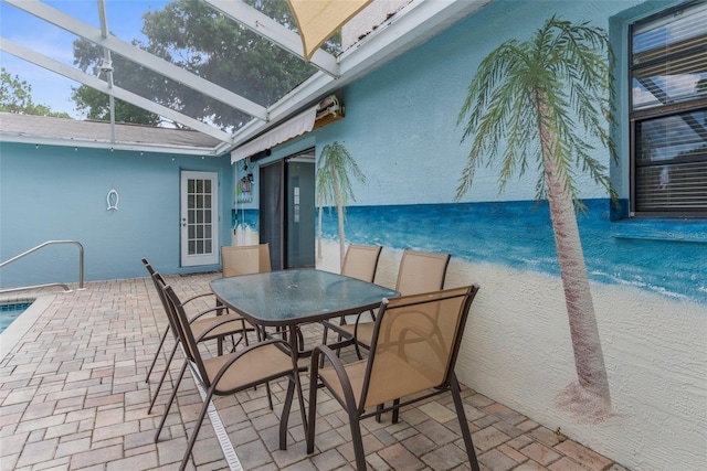 5112 Odin St, Spring Hill, FL 34608 - view of patio / terrace featuring glass enclosure, an outdoor pool, and outdoor dining space