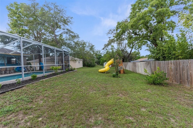 5112 Odin St, Spring Hill, FL 34608 - fenced backyard with a playground and a lanai