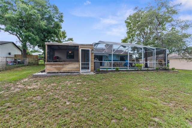 5112 Odin St, Spring Hill, FL 34608 - rear view of house with glass enclosure and an outdoor pool