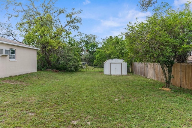 5112 Odin St, Spring Hill, FL 34608 - fenced backyard with a storage unit and a wall mounted AC