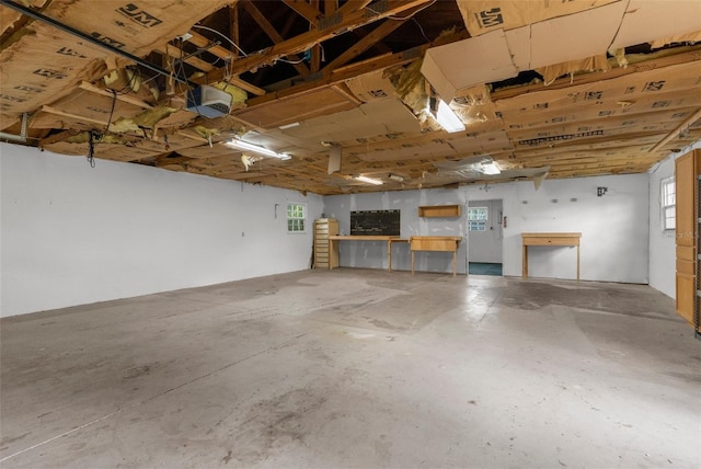 5112 Odin St, Spring Hill, FL 34608 - garage with a garage door opener and a workshop area
